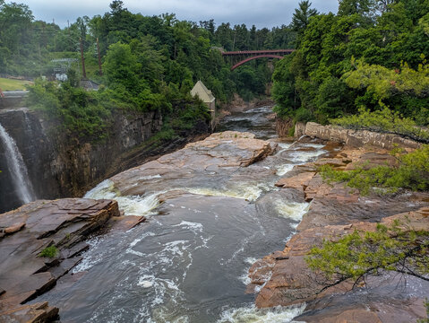 Rainbow Falls and historic red arch bridge at Ausable Chasm