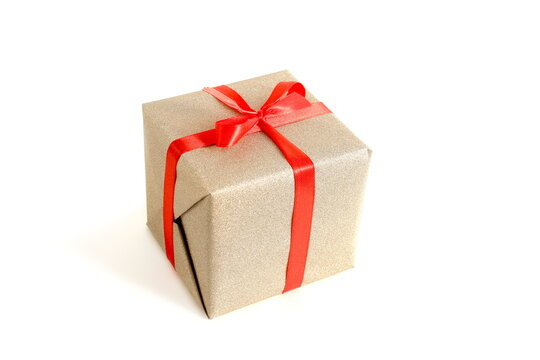 There is a gift box with a red bow on a white background.
