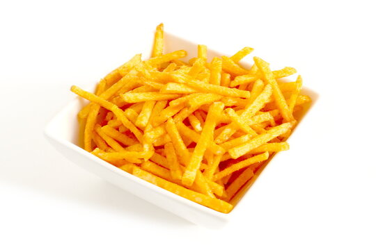 There are potato chips cut into strips in a ceramic plate.