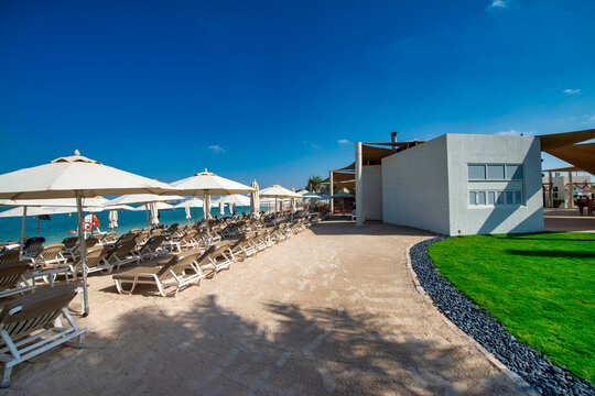 Sunny Yas Island beach in Abu Dhabi sparkling under clear blue skies on perfect summer day.