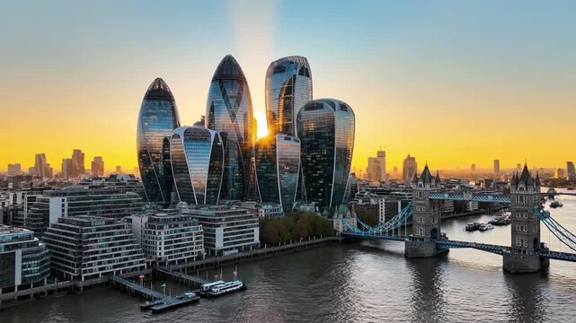 Sunset over a riverfront skyline of gleaming glass towers and a historic bridge. Golden hour glow!!!