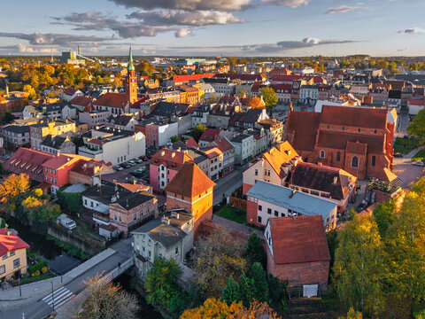 The market square in Starogard Gdanski in the light of the setting sun at autumn. Poland