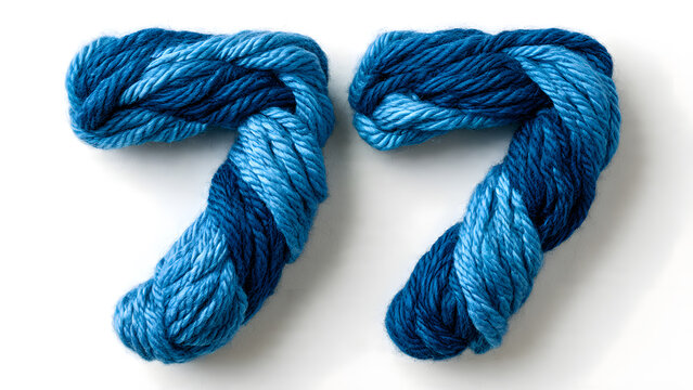 Creative number 77 made from twisted blue yarn on white background