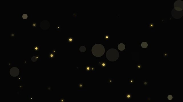 Glowing gold particles floating in black space, abstract motion video clip