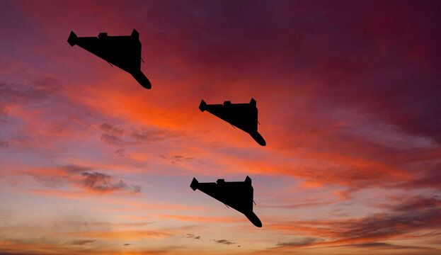 Shahed Kamikaze Drones Silhouetted Against Sunset