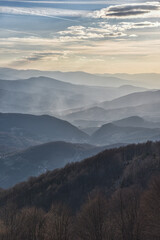 Fototapeta premium Kakanj, Bosnia and Herzegovina – March 26, 2026: Scenic hiking view from Mountain Lipnica, one of the highest peaks in the area, featuring a breathtaking panoramic landscape with rolling hills, dense 