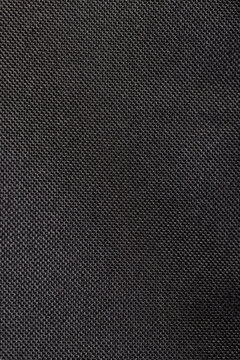 black dense synthetic fabric for the production of bags and other items, fabric texture