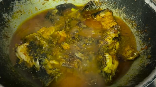 The process of cooking yellow spiced tilapia using pesmol method