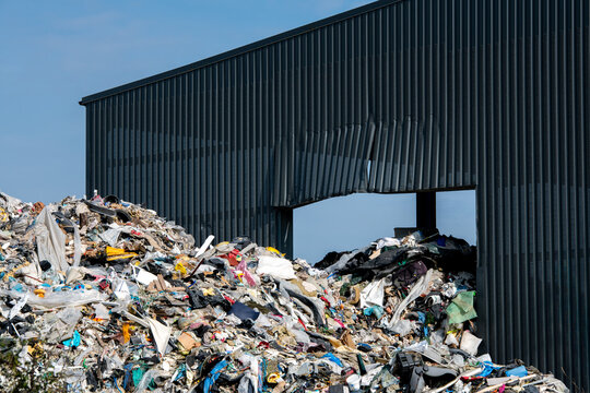 Large pile of household and industrial waste at a recycling center and landfill facility in Northern France, concept of environmental pollution and waste management