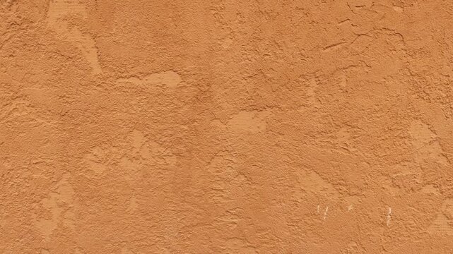 Rough, brown plastered wall with veins. Concrete wall texture, decorative plaster.