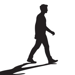 Fototapeta premium A man is depicted walking forward casting a long shadow presented as a striking silhouette