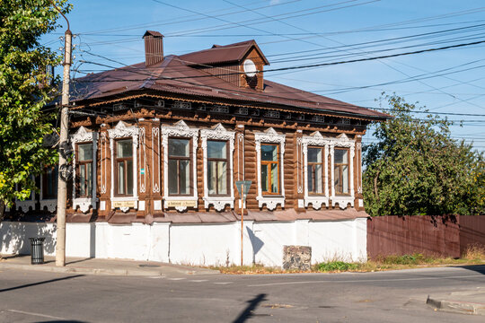 Yelets, Lipetsk Oblast, Russia, September 21, 2025: An old wooden house with carved shutters on a street in Yelets