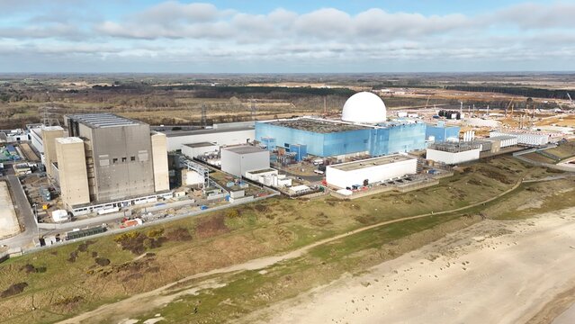 Aerial view of the Sizewell Power Station, a stark contrast of industrial might against the serene beach, Leiston, United Kingdom.