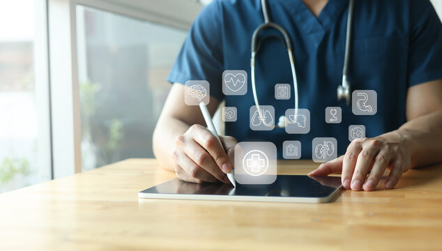 close up expertise doctor man hand check on digital tablet about health checkup program annual to prepare for consulting and diagnosis of patient for healthcare and technology concept
