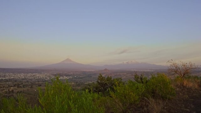 Popocatepetl and iztaccihuatl volcanoes in mexico at sunset