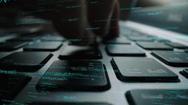 This image captures hands actively typing on a laptop keyboard amidst a backdrop of streaming digital code, symbolizing technology and programming work. Xenic
