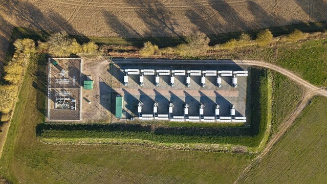 Aerial view of the substation and battery energy storage casting stark shadows on the ground, Ipswich, United Kingdom.