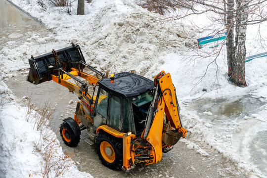 Municipal snow removal service operating in winter urban environment.