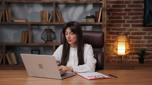 Business woman plans next steps for project goals in office.