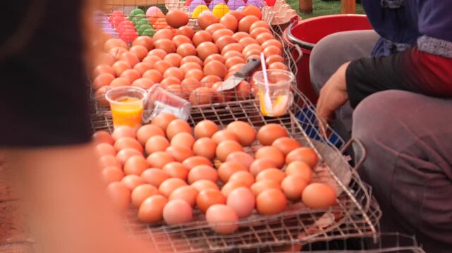 Grilling eggs, street food, Thailand