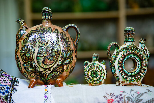 Traditional Kosiv ceramic kumaneets vessels with birds