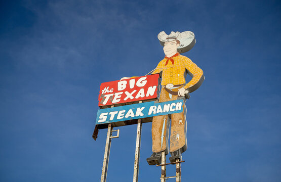 The Big Texan Steak Ranch Light Up Sign With Big Tex Mascot Along Road in Amarillo, Texas
