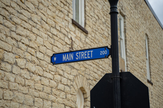Main Street Sign on Lamp Post Alone Stone Brick Building in Decatur, Texas