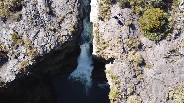 Aerial top-down view of Cascada de Fuego waterfall, Pita River, Cotopaxi, Ecuador.