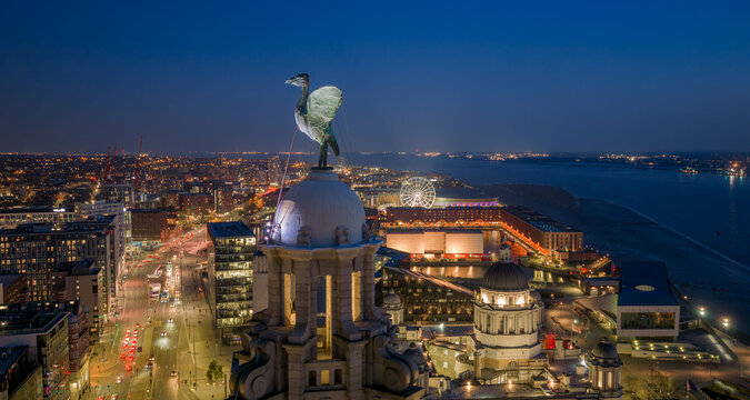 Liverpool Royal Liver Building liver bird close up overlooking city centre skyline, iconic landmark, historic architecture, waterfront River Mersey, UK travel destination, cultural symbol