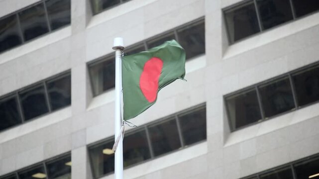 The Bangladeshi flag on a flag pole at Toronto City Hall&rsquo;s Nathan Phillips Square.

