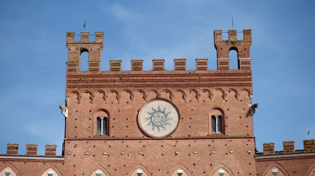 Medieval Brick Facade and Clock Tower in Siena, Tuscany