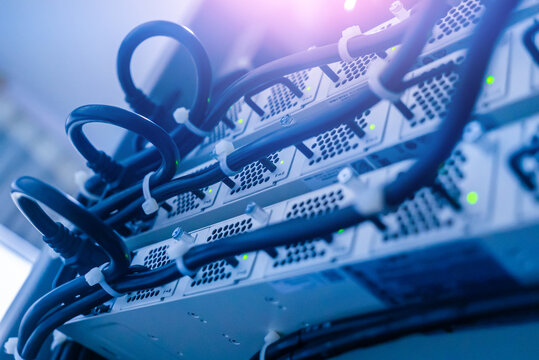 Close-Up of Server Rack with Power Cables and Indicator Lights