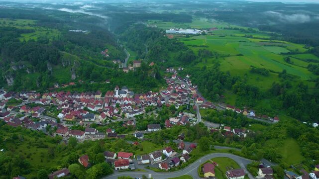 Aerial view of the city Pottenstein in Germany, Bavaria on a cloudy day in Spring