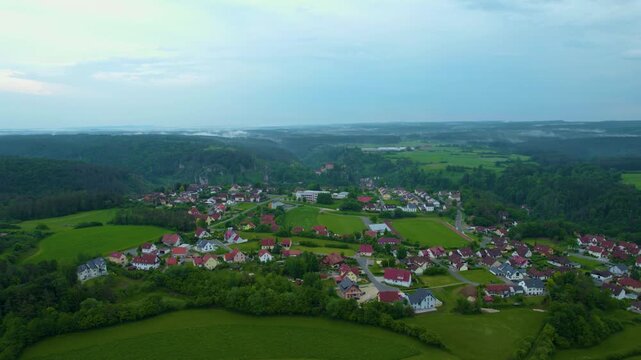 Aerial view of the city Pottenstein in Germany, Bavaria on a cloudy day in Spring