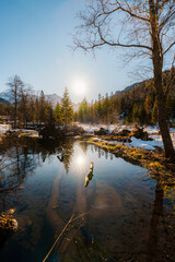 Obraz premium Mountain view with hiking path in Javorova dolina nature reserve during a winter sunny day in Slovakia in High Tatras mountains