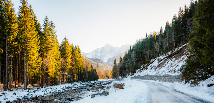 Mountain view with hiking path in Javorova dolina nature reserve during a winter sunny day in Slovakia in High Tatras mountains