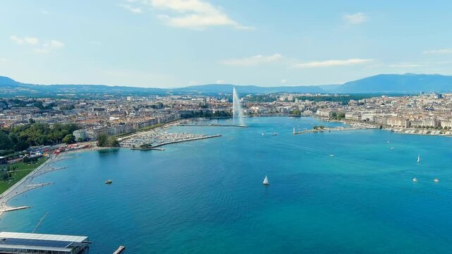 Geneva, Switzerland. Fountain Je-Deau. Large fountain jet up to 140 meters. The main attraction of Lake Geneva. Summer day. Drone footage