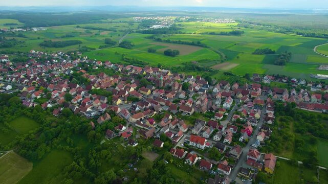 Aerial view of the city Kalchreuth in Germany, on a cloudy day in spring.