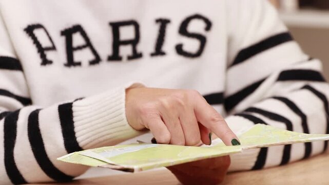 hand checking the map and destination of the trip