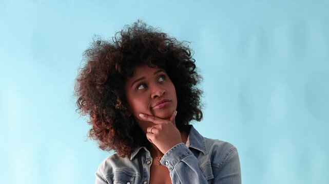 young woman isolated in background thinking