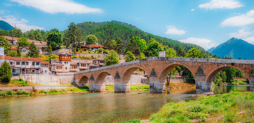 Fototapeta premium Old Stone Bridge (Stara Cuprija) over the Neretva River in Konjic, a masterpiece of Ottoman architecture, Bosnia and Herzegovina.