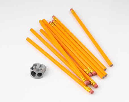 Pencils with a rubber isolated. Unsharpened yellow wooden graphite pencils