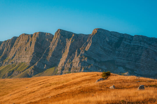 Majestic limestone cliffs of Mount Lebrsnik on the border of Bosnia and Herzegovina and Montenegro, scenic mountain landscape in the Dinaric Alps.