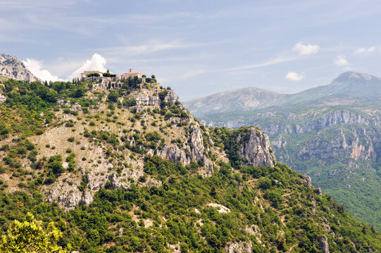 Perched village viewed from a distance overlooking the Loup River valley in Southeast France