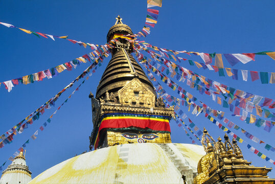 Visit to the historic Swayambhunath Stupa in Kathmandu showcasing its architecture and colorful prayer flags