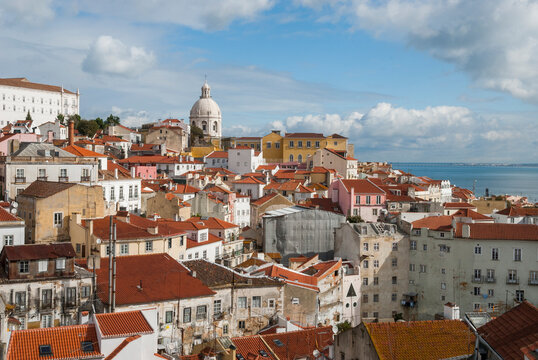 Overview of Alfama district showing rooftops and buildings from belvedere Portas do Sol in Lisbon Portugal during a sunny day