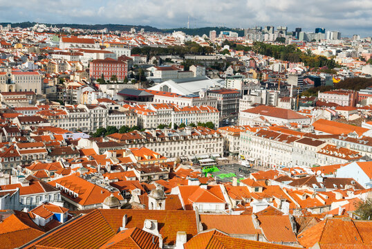 Overview of Baixa and Chiado districts from Sao Jorge Castle in Lisbon with rooftops and buildings of the city