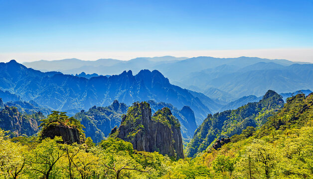 Majestic mountain view from Huangshan showcasing layered peaks and lush greenery in Anhui Province, China