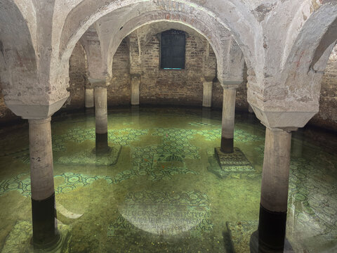 Flooded area in the crypt of Basilica of San Francesco in Ravenna shows historical architecture and water effects