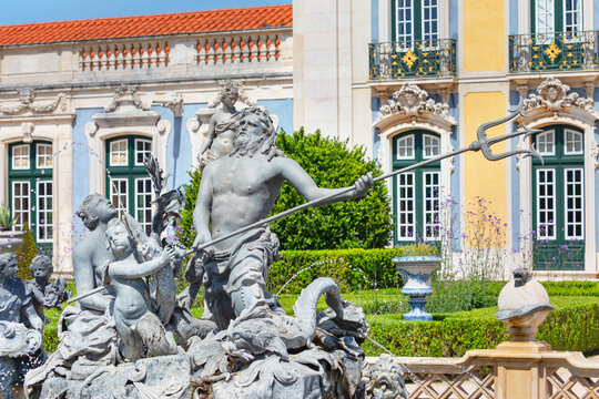 Sculpture of Neptune surrounded by figures at Queluz National Palace gardens in Lisbon, Portugal